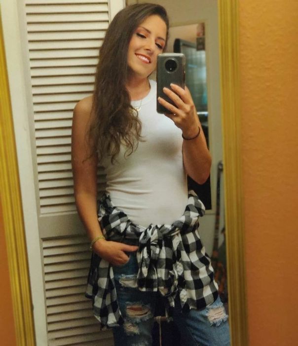 A reviewer is seen in a white top.