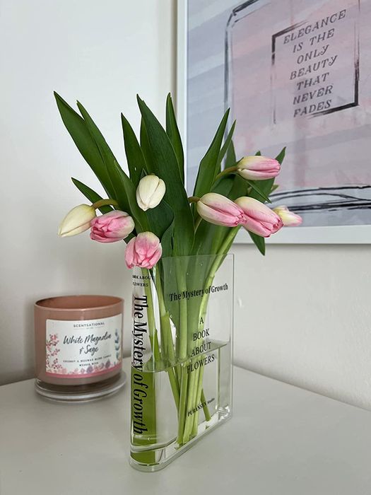 A reviewer showcasing tulips arranged in the vase