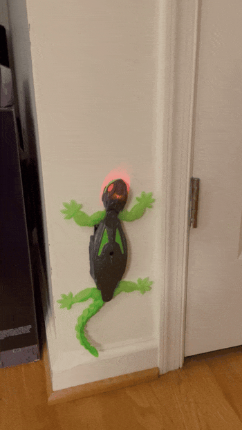 A toy lizard scaling a wall