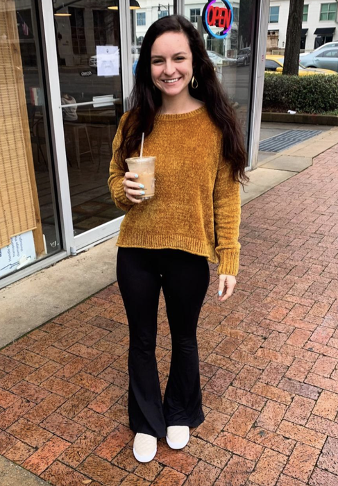 A reviewer wears black pants.
