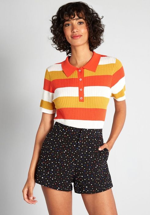 A model wearing the red, sand, and white striped fitted polo