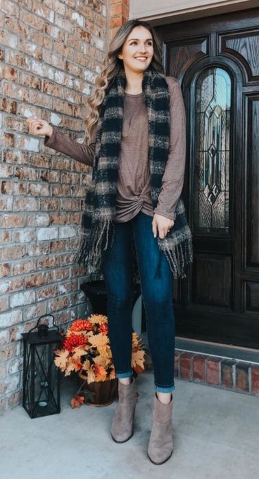 Reviewer wearing the brown top featuring a twist front detail