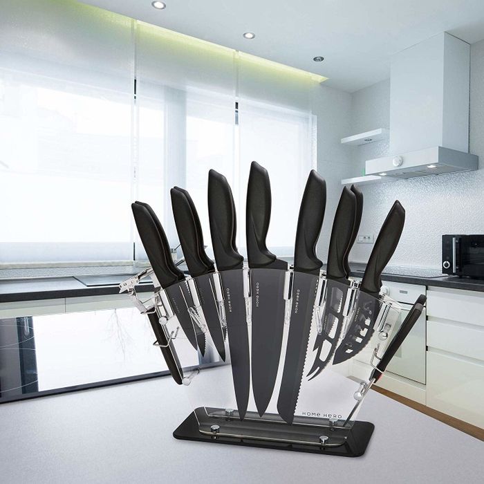 A transparent knife block containing a set of knives