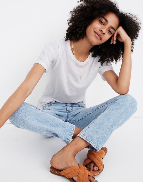A model showing off the textured white tee