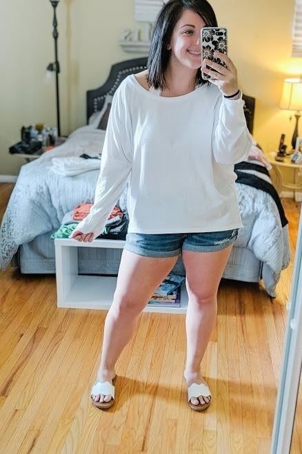 A reviewer sporting the white version of the pullover