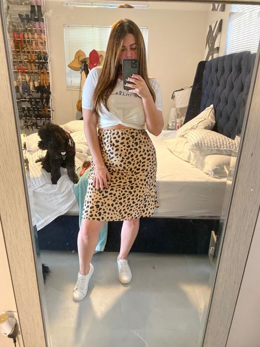 A reviewer wearing a skirt.