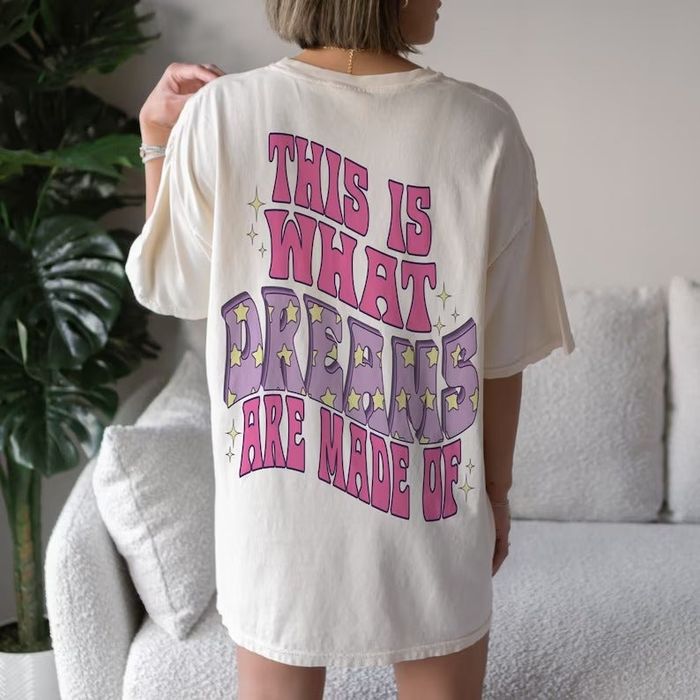 A model wearing an oversized tee with a retro design