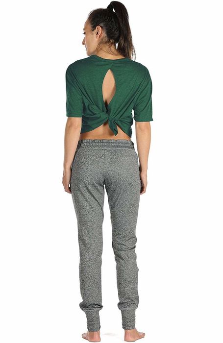 The same model with the shirt tied into a cropped style in the back.
