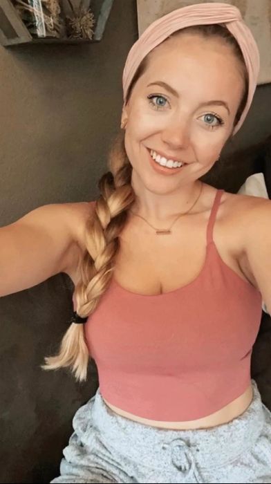 A reviewer wearing the pink top