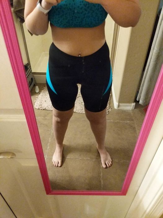 A reviewer is seen wearing blue and black bike shorts.
