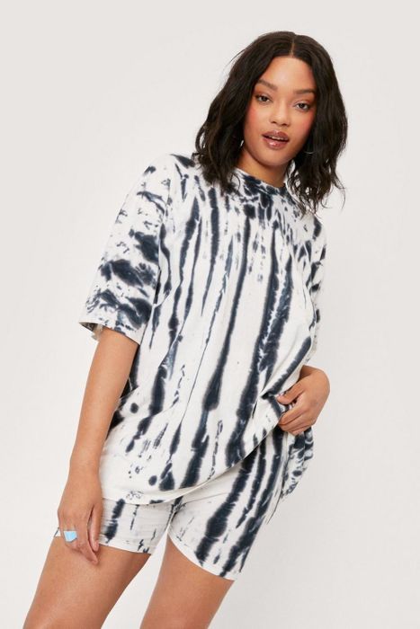 A model is wearing a tie-dye biker shorts and T-shirt set.