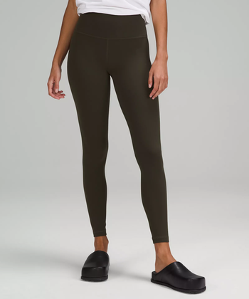 A model showcasing the dark olive leggings