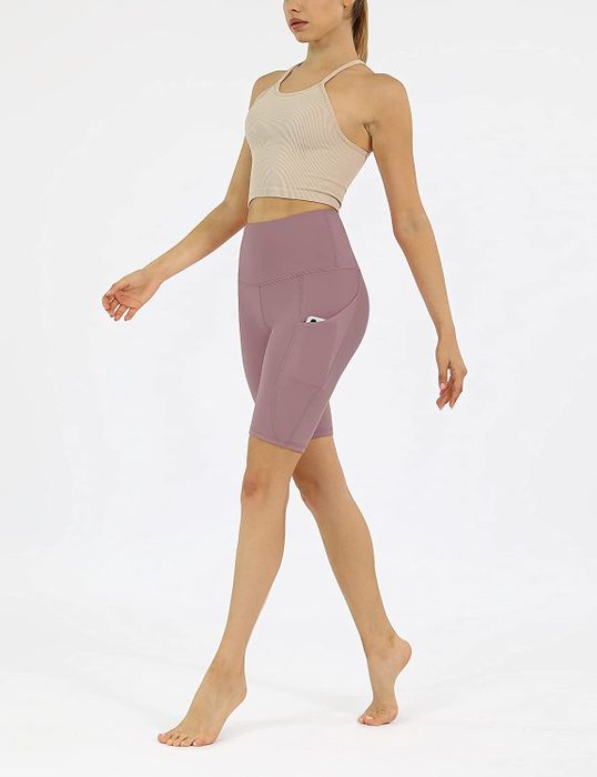 A model is wearing bike shorts with a 9-inch inseam.