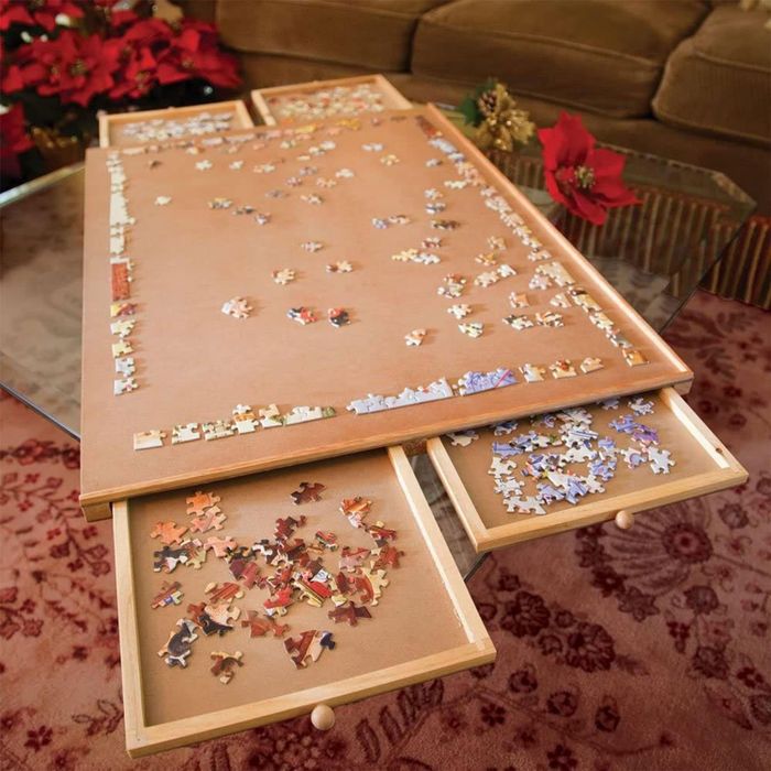 The wooden puzzle board in use on a table