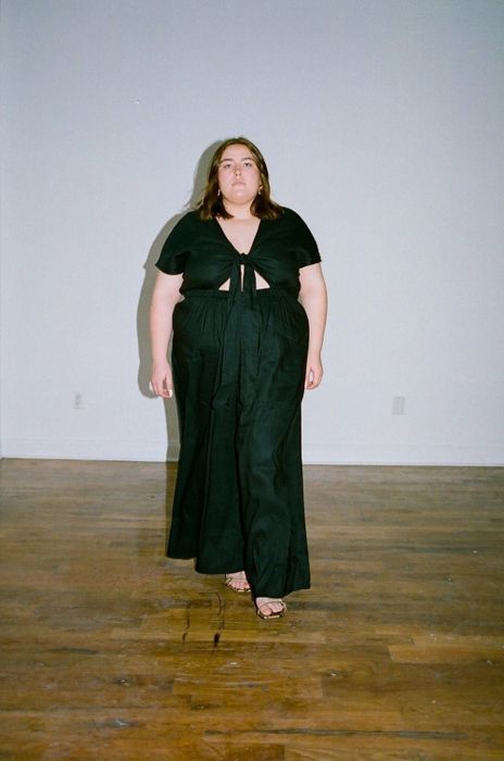A model wearing the wide-leg jumpsuit in a size 3X