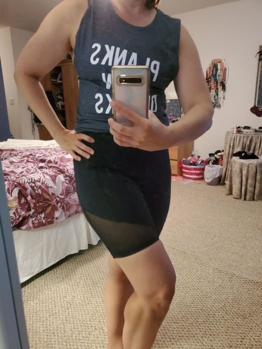 Reviewer wearing black biker shorts with mesh panels