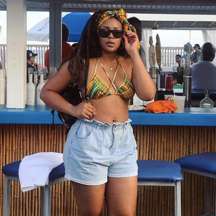 reviewer flaunting the light blue denim shorts