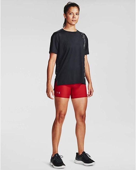 A model is wearing red Under Armour bike shorts.