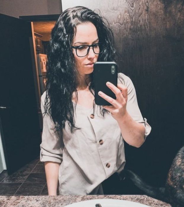 an individual sporting the button-up shirt neatly tucked into their trousers