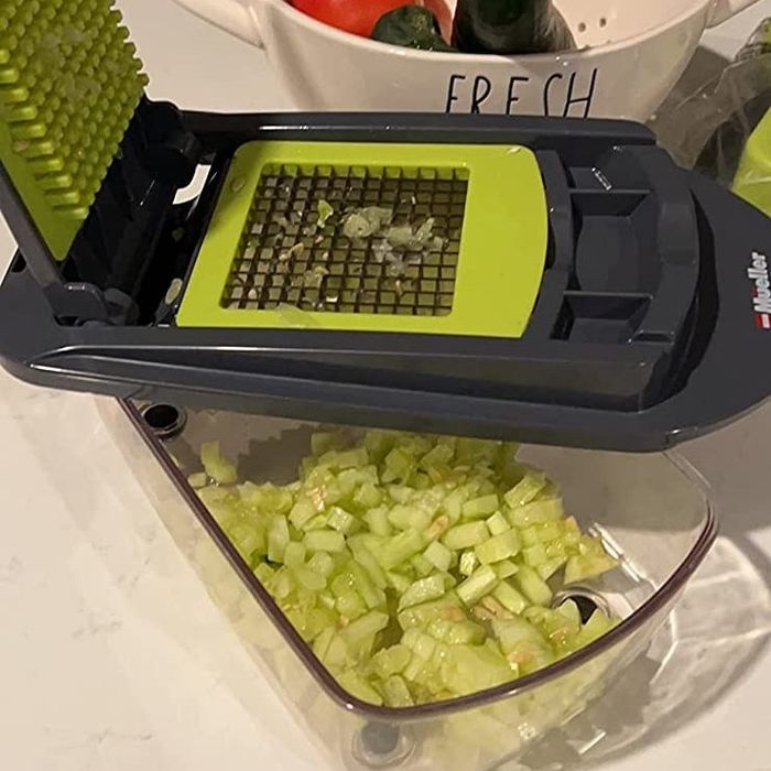 A reviewer's photo showing diced celery inside the chopping unit