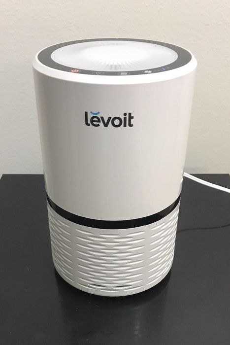 A reviewer's photo of the air purifier