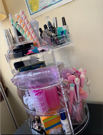 A reviewer's photo showing the organizer filled with various products