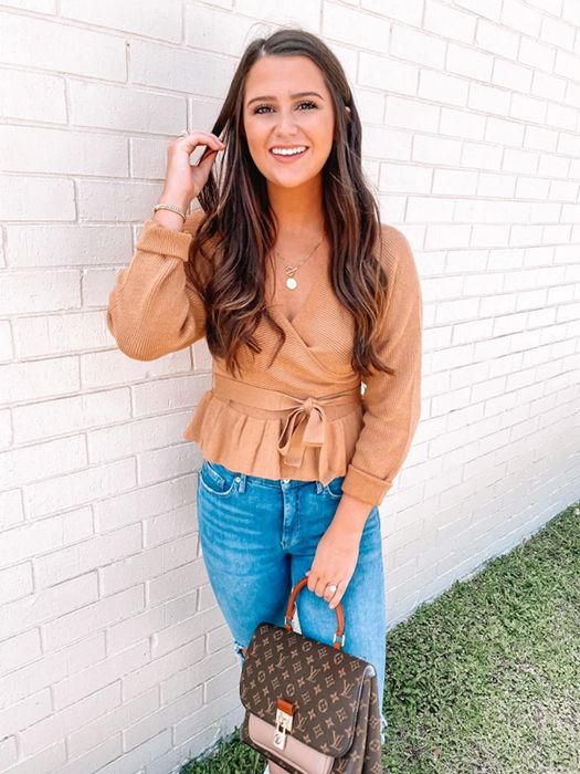 A different reviewer is showcasing the sweater in tan.