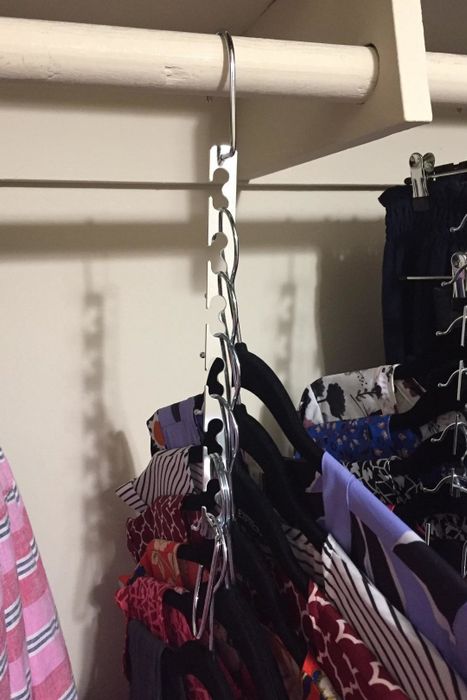 A reviewer's photo of the same shirts occupying only a small portion of the closet space