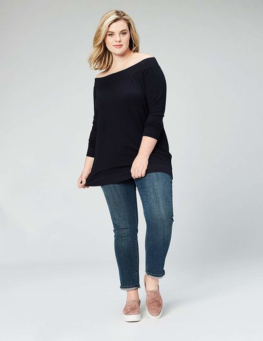 An off-the-shoulder top designed to provide ample coverage, extending past the hips
