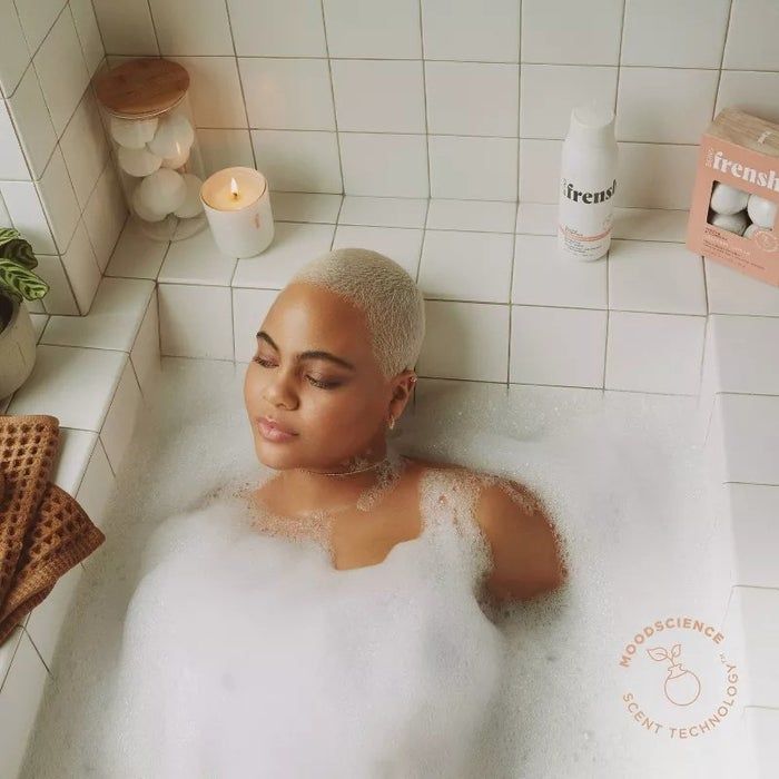 a person enjoying a bath with the bath bombs