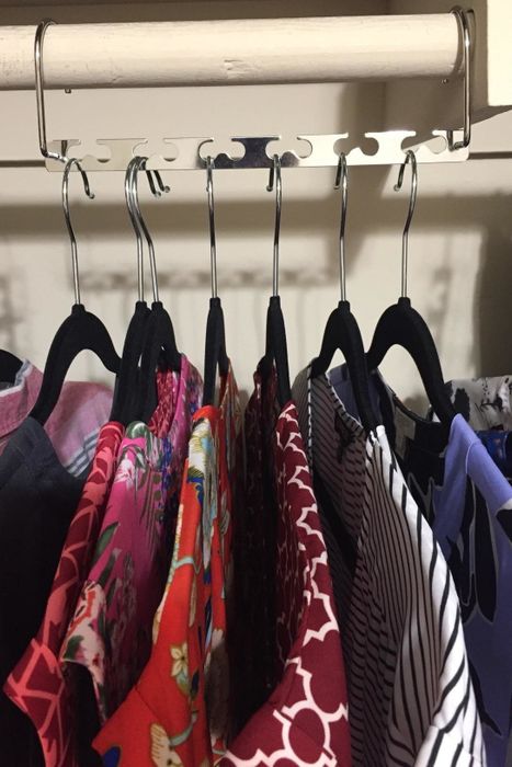 A reviewer's photo showing seven shirts neatly hanging on their closet rack