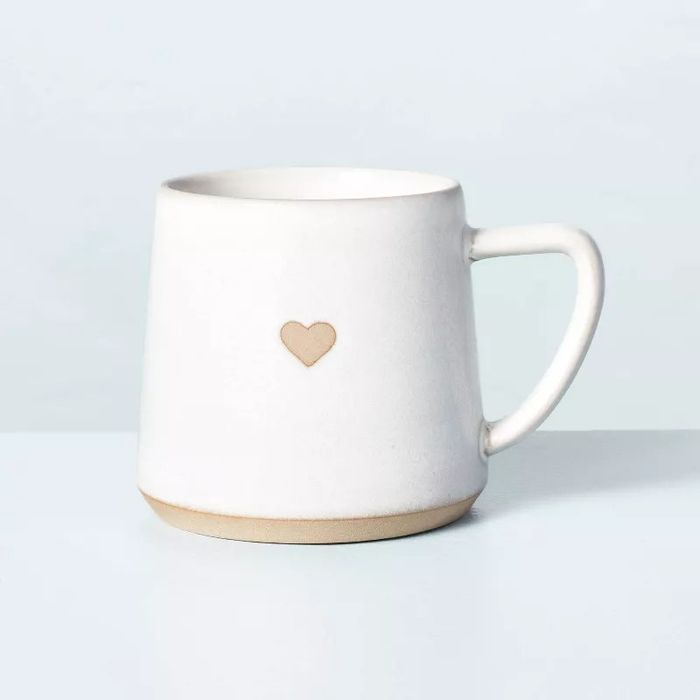 a stoneware mug adorned with a delicate heart print