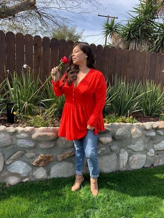 Another reviewer showcasing the top in a vibrant red