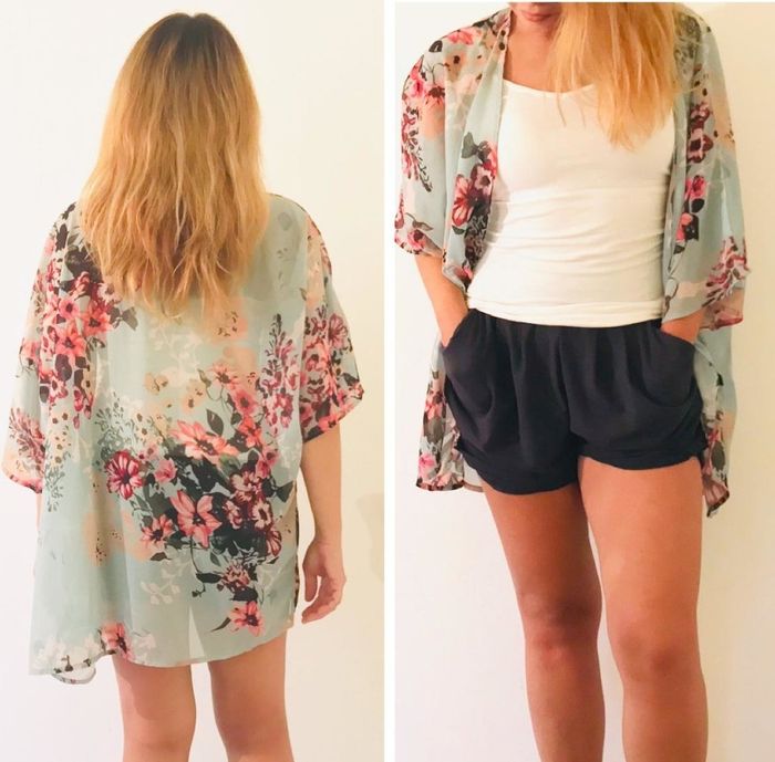 A reviewer wearing the green kimono-style cardigan