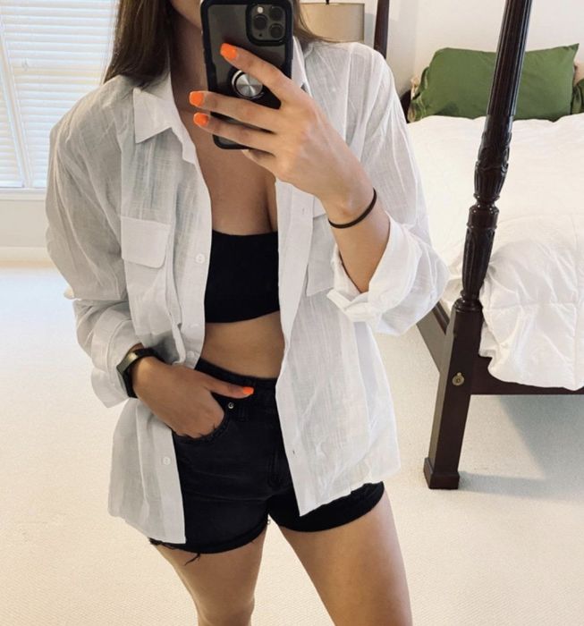 A person wearing the top unbuttoned