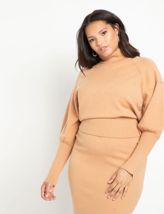 The model is wearing the sweater in beige