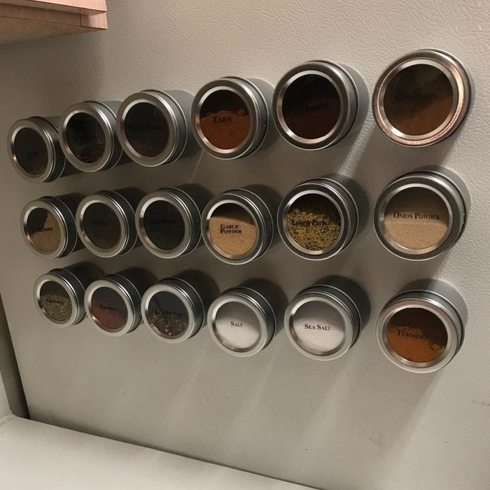 a reviewer’s photo showing three rows of six round spice jars neatly arranged on a wall