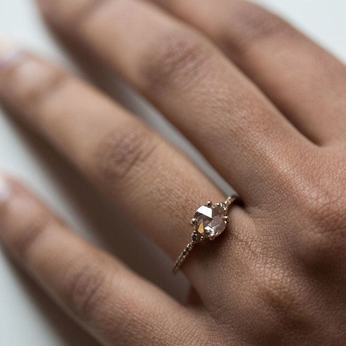 a model elegantly showcasing the ring