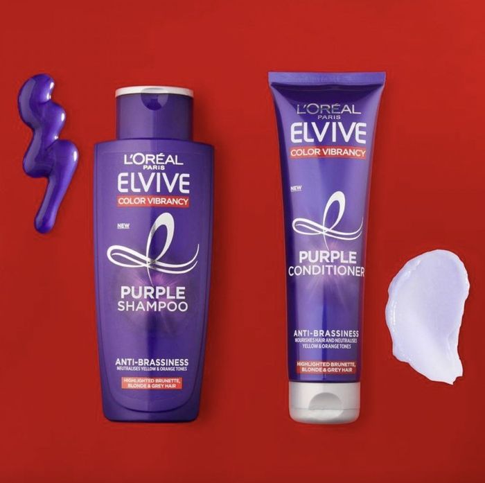 A bottle of purple shampoo and conditioner