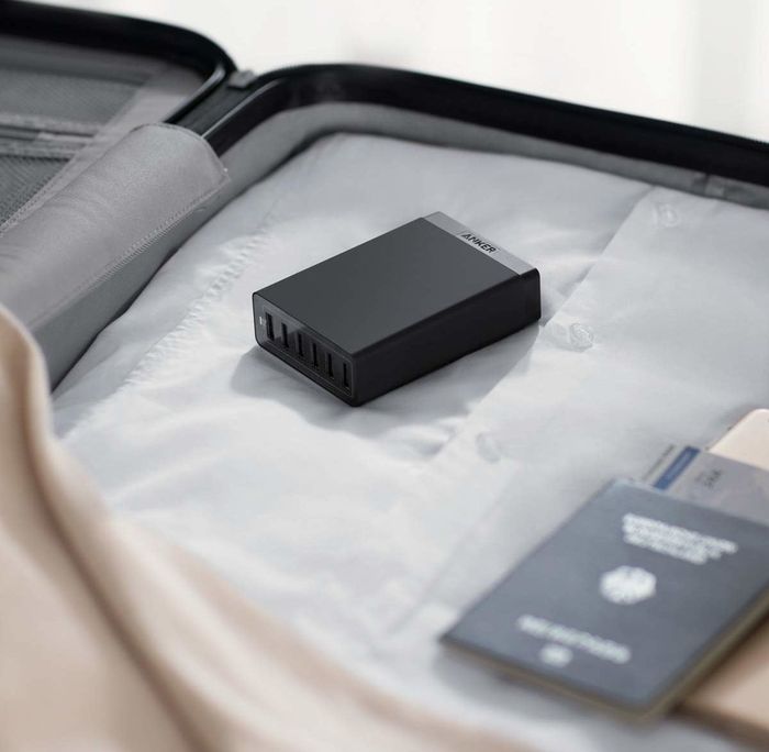 The outlet is neatly packed in a suitcase, showing its travel-friendly design.