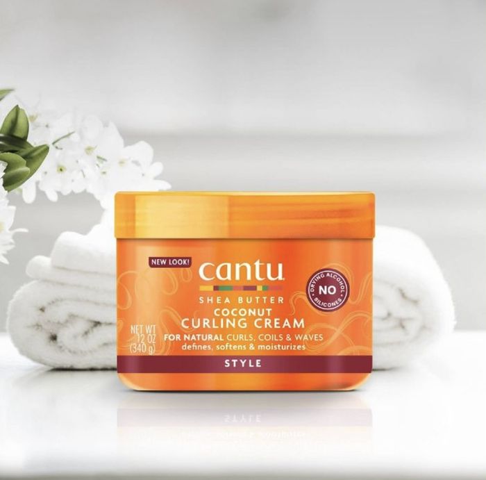 A tub of curling cream