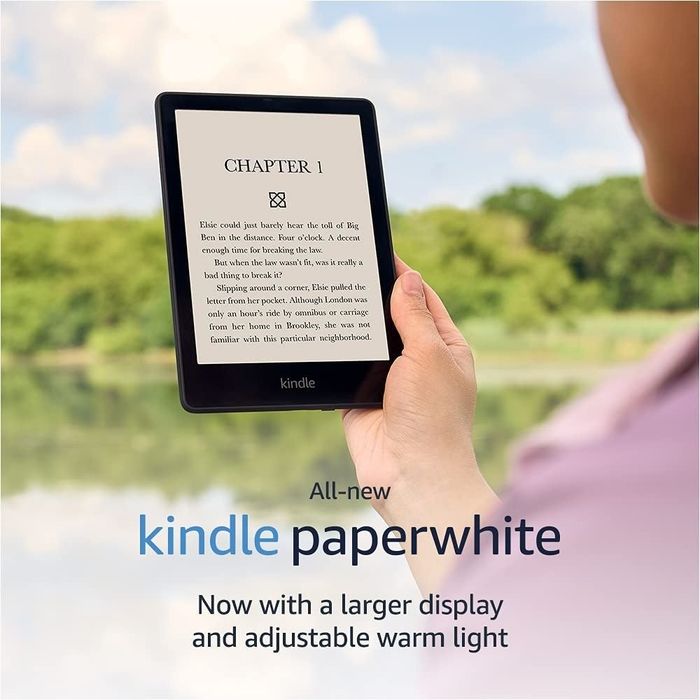 person enjoying a Kindle Paperwhite while reading