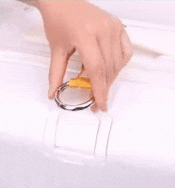 A GIF demonstrating how to attach a yellow strap to a white suitcase and connect a black tote bag to it.
