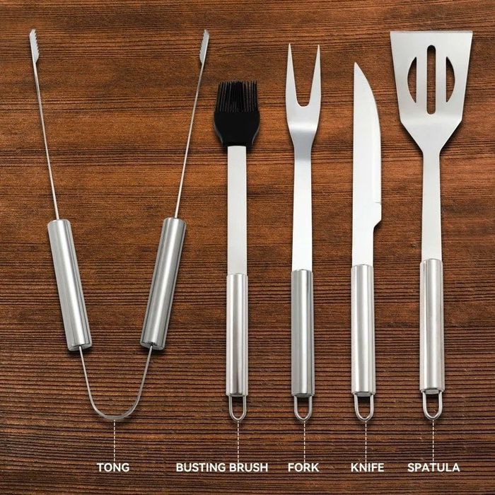The sleek and durable grilling tools, ready for action on the barbecue.