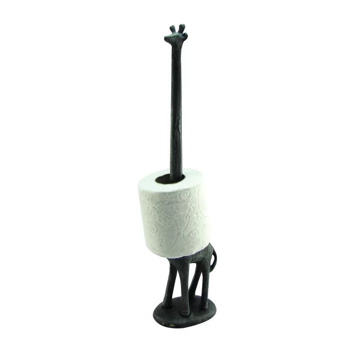 A giraffe toilet paper holder with a roll of toilet paper in place.