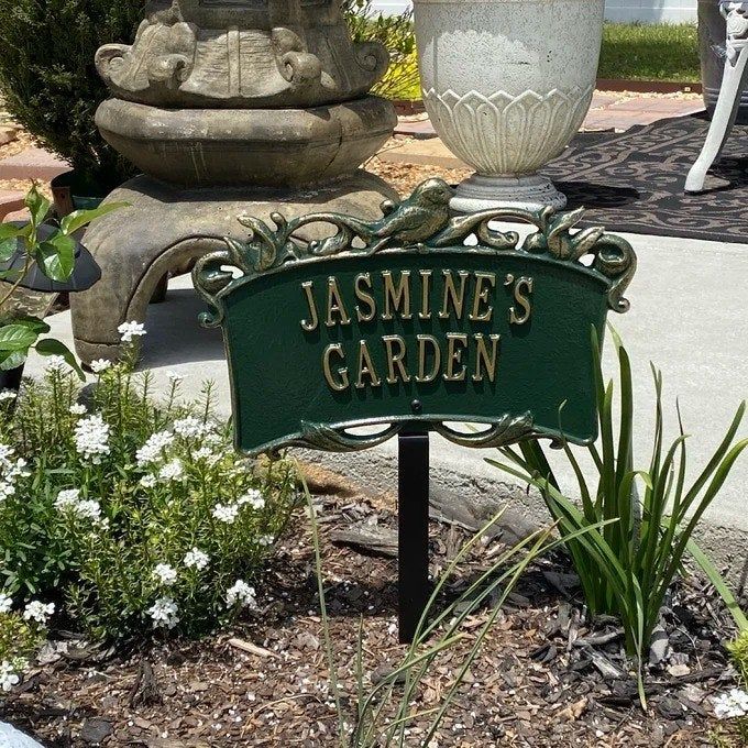 A reviewer image of the personalized garden sign reading "Jasmine's Garden"