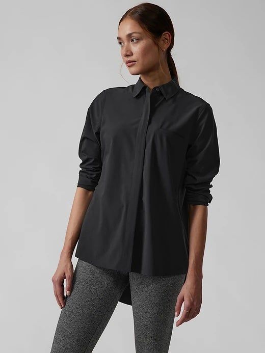 A model displaying the top in a sleek black color