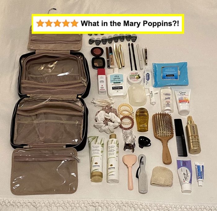 The reviewer displays all the items they successfully packed into their bag, laid out across the bed for easy viewing.