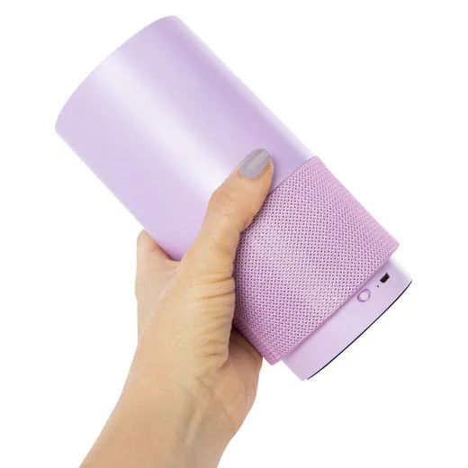 A model showcasing the purple speaker