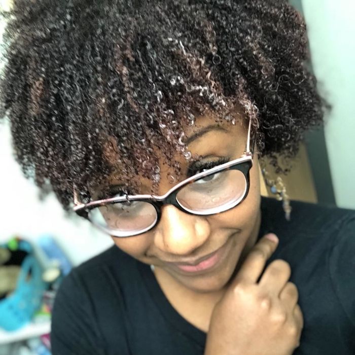 A reviewer with coily hair.